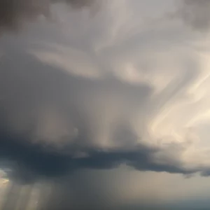 Asperitas clouds forming a wave-like structure in the stormy sky.